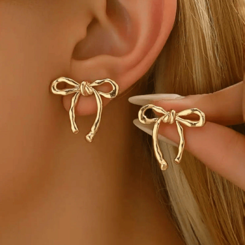 Gold bow earrings, simple and stylish glossy earrings